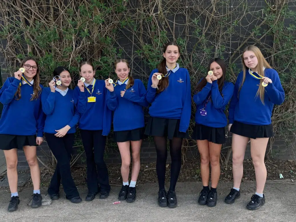 Some of the team showing off their gold medal bling!