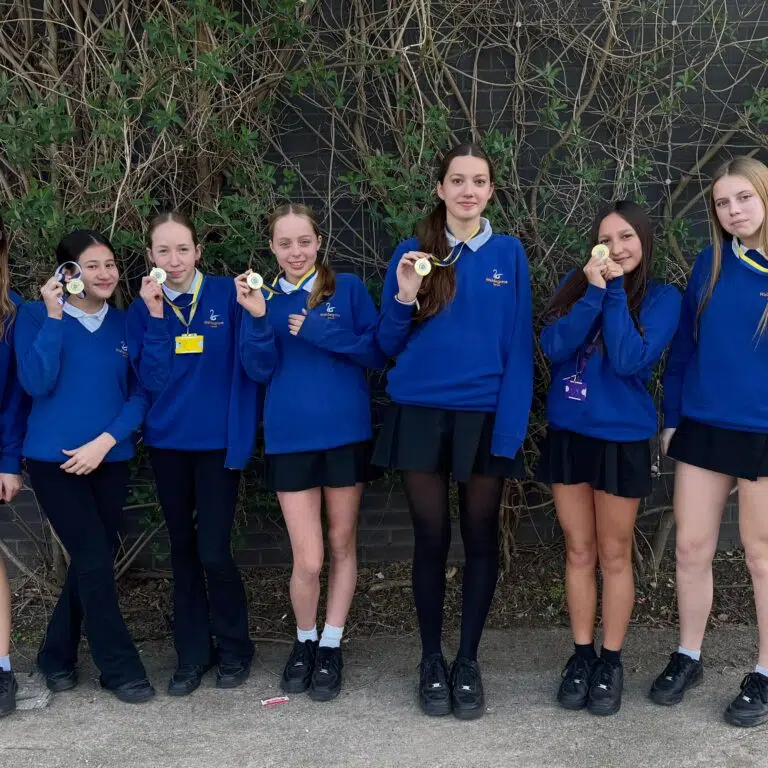 Some of the team showing off their gold medal bling!